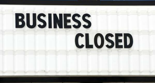 A sign indicates that a business is closed